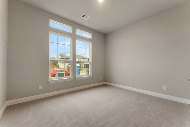 304 Alicia Ct, Mansfield, TX 76063 - empty room featuring carpet floors, visible vents, plenty of natural light, and baseboards