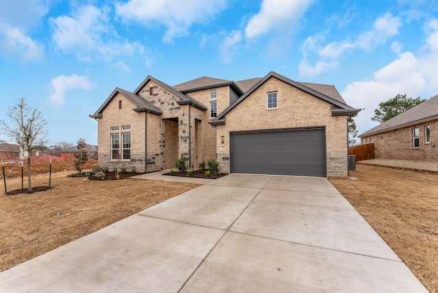 304 Alicia Ct, Mansfield, TX 76063 - traditional home with a garage, brick siding, fence, concrete driveway, and stone siding