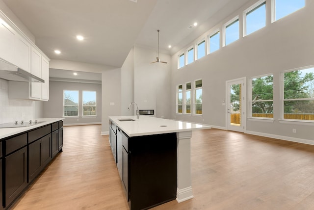 304 Alicia Ct, Mansfield, TX 76063 - kitchen with open floor plan, hanging light fixtures, a kitchen island with sink, light countertops, and a sink
