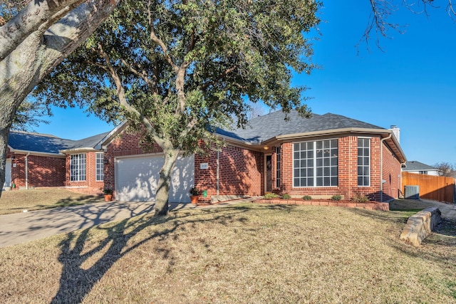 ranch-style house with a garage and a front lawn