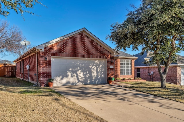 ranch-style house with a garage and a front yard