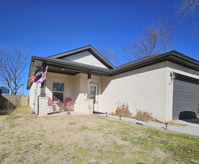 view of front of home with a garage and a front yard