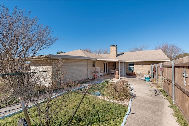 back of property featuring a patio area