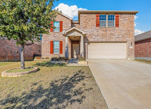 view of front property with a garage and a front yard