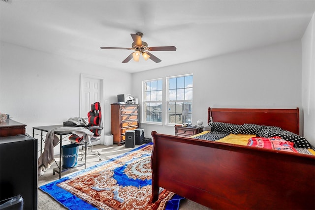 carpeted bedroom with ceiling fan