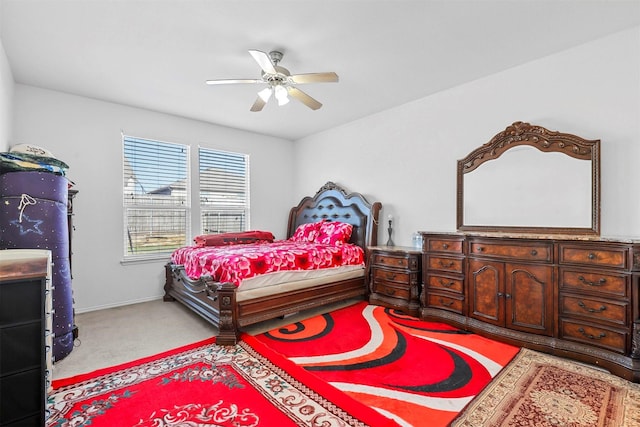 bedroom with light colored carpet and ceiling fan