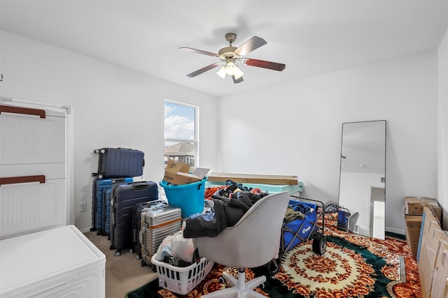 interior space with light carpet and ceiling fan