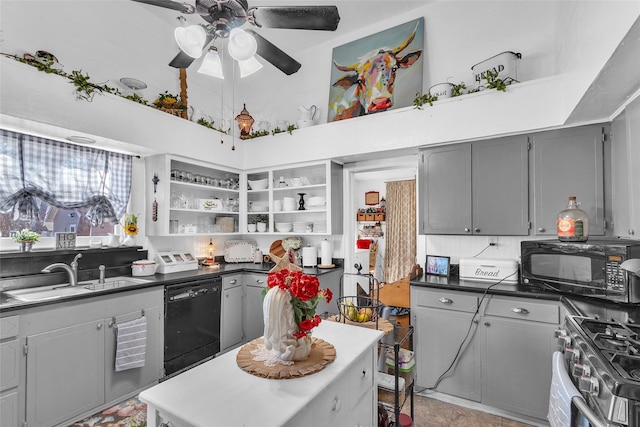 kitchen featuring gray cabinetry, sink, a high ceiling, and black appliances