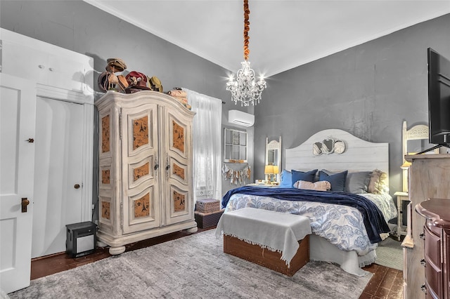 bedroom featuring a notable chandelier, dark wood-type flooring, ornamental molding, and an AC wall unit