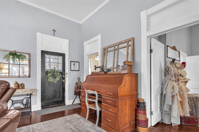 foyer with crown molding and dark hardwood / wood-style floors