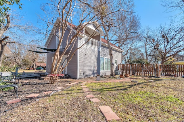 view of home's exterior with a yard