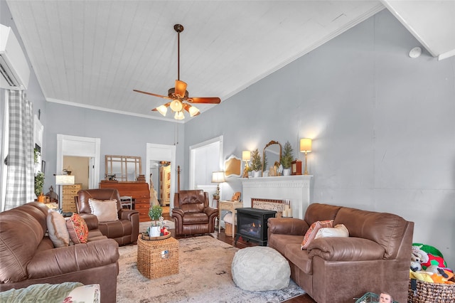 living room with crown molding and ceiling fan