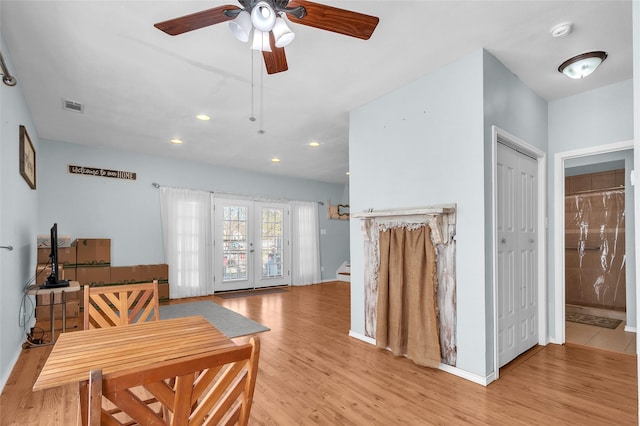 interior space featuring french doors, ceiling fan, and light hardwood / wood-style flooring