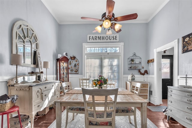 dining space featuring hardwood / wood-style floors, ornamental molding, and ceiling fan