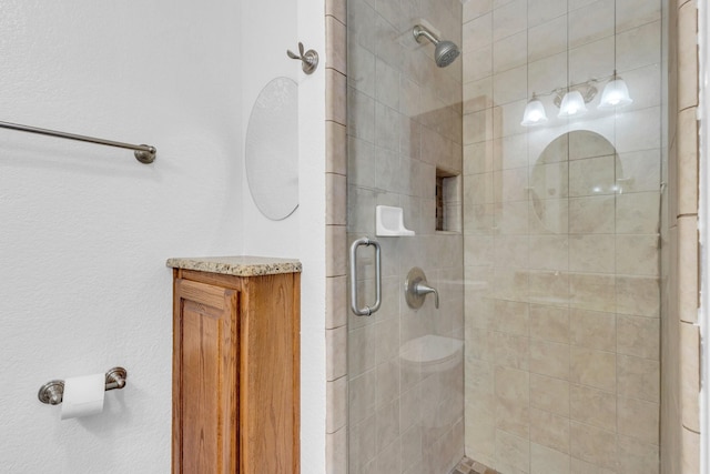 bathroom with a shower with door