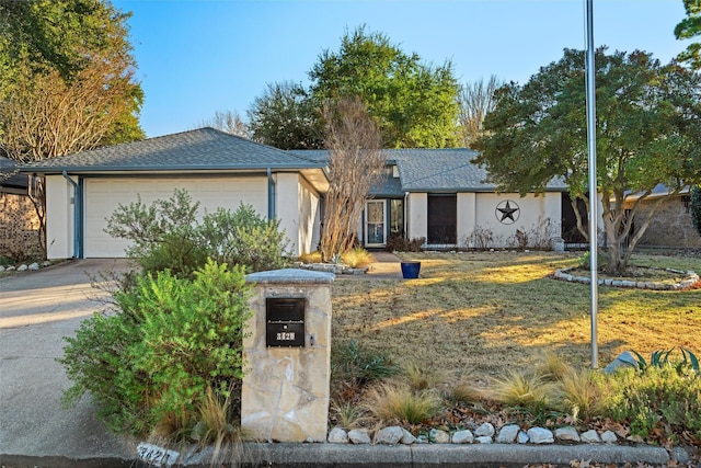 ranch-style home featuring a garage