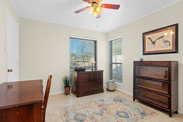 home office featuring ceiling fan and light tile patterned floors