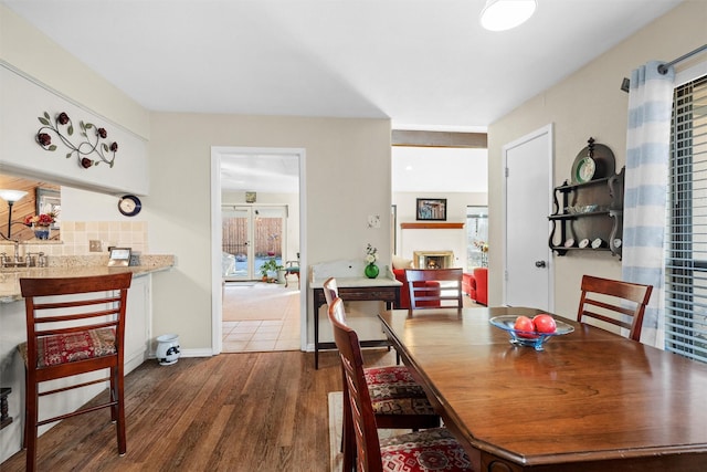 dining area featuring dark hardwood / wood-style flooring