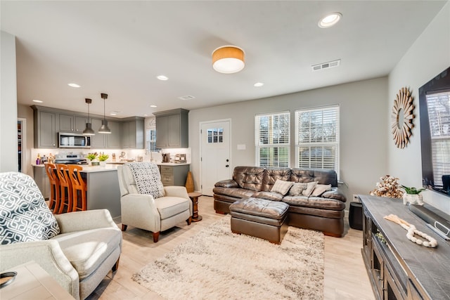 living room with light hardwood / wood-style flooring