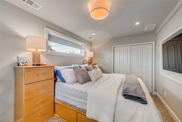 carpeted bedroom with a closet