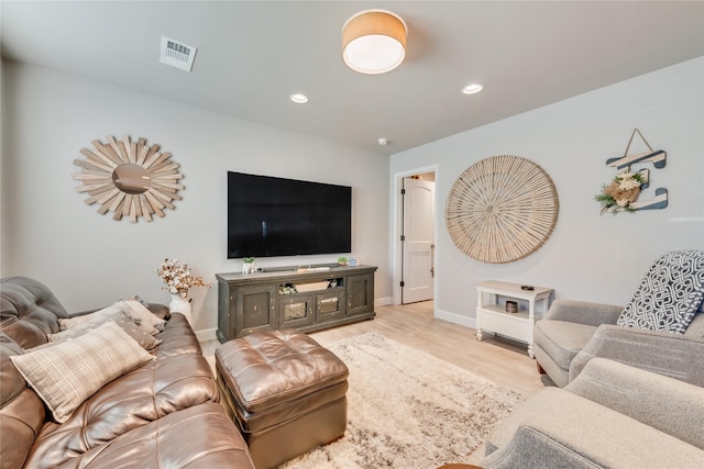 living room with light hardwood / wood-style floors