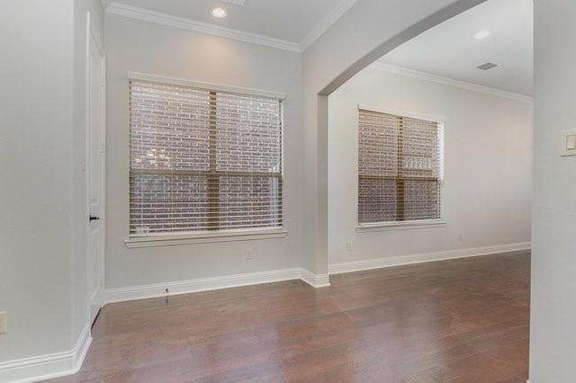 unfurnished room featuring ornamental molding and dark hardwood / wood-style floors