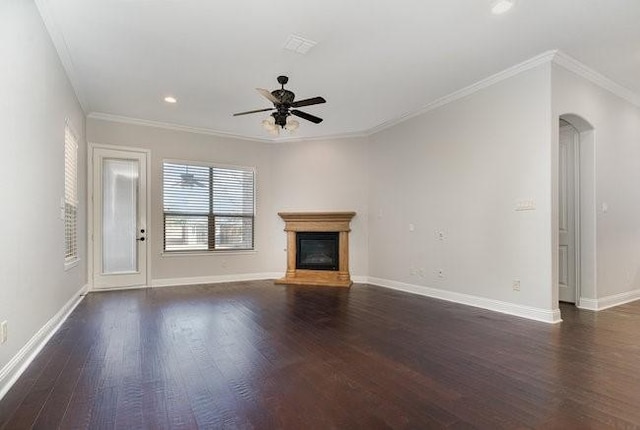 unfurnished living room with crown molding, dark wood-type flooring, and ceiling fan