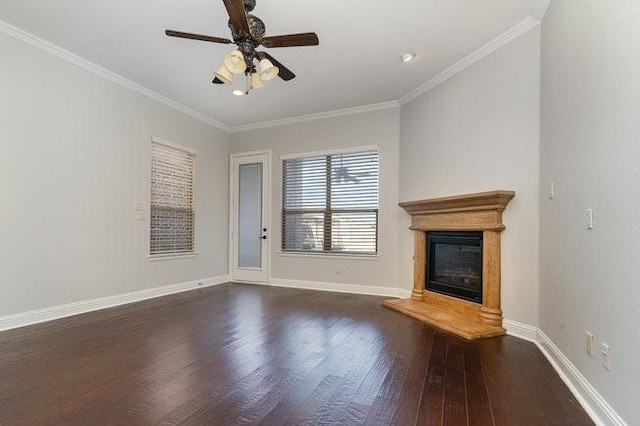 unfurnished living room with ornamental molding, ceiling fan, and dark hardwood / wood-style flooring