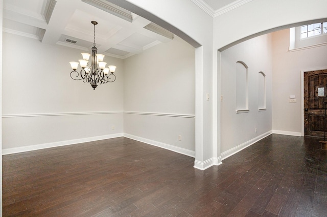 foyer featuring baseboards, coffered ceiling, arched walkways, dark wood finished floors, and beamed ceiling