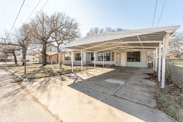 rear view of house with a carport