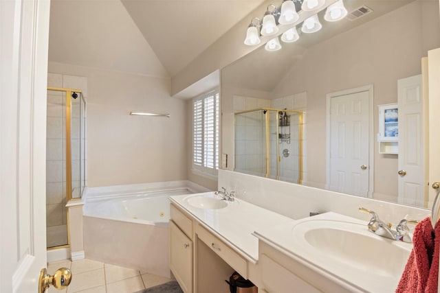 bathroom featuring tile patterned flooring, vaulted ceiling, independent shower and bath, and vanity