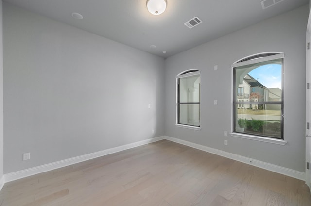 spare room featuring light wood-type flooring