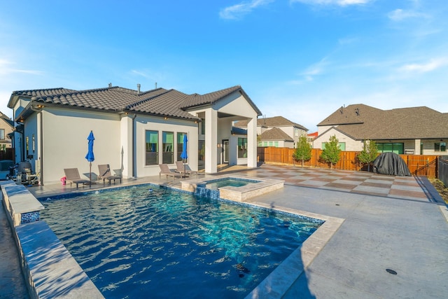 view of pool featuring an in ground hot tub and a patio