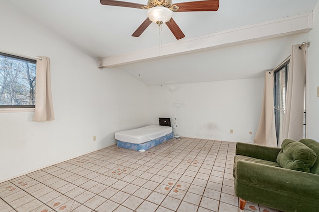 unfurnished bedroom featuring vaulted ceiling with beams and ceiling fan