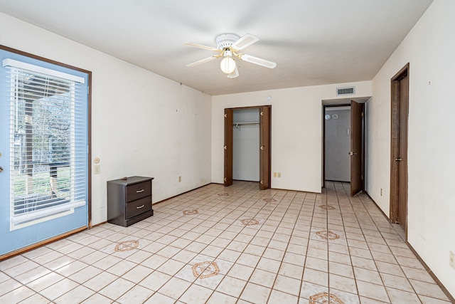 unfurnished bedroom featuring access to outside, a closet, and ceiling fan