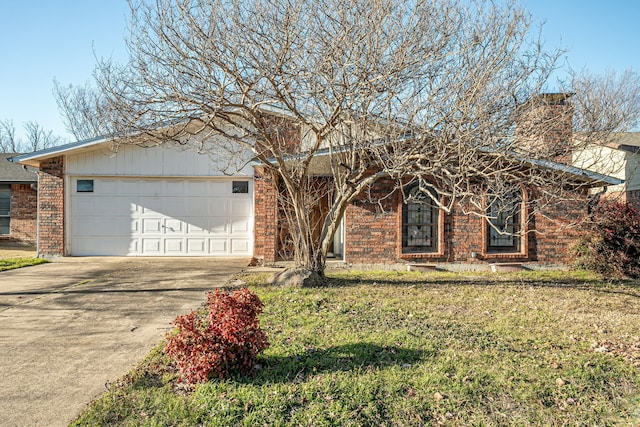 view of front of property featuring concrete driveway, a chimney, an attached garage, a front yard, and brick siding