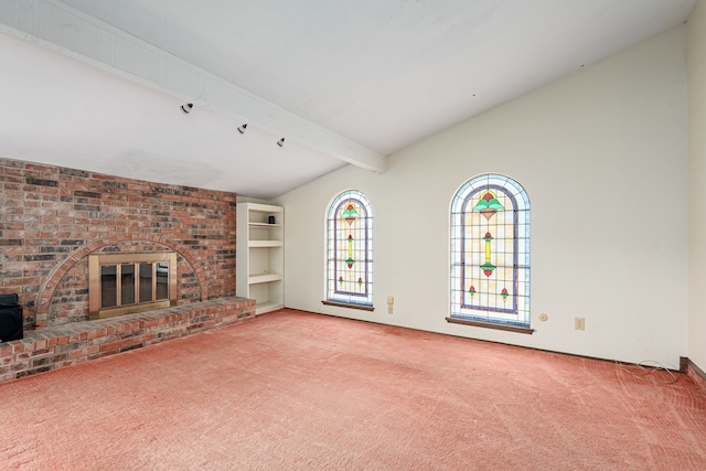 unfurnished living room with carpet, vaulted ceiling with beams, and a fireplace