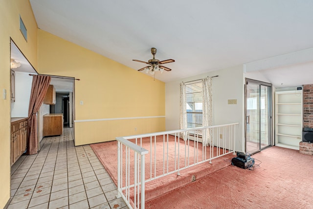 interior space with light tile patterned flooring and lofted ceiling