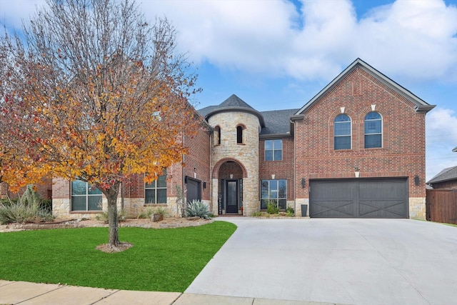 view of front of property featuring a garage and a front yard