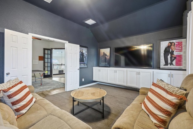 living room with vaulted ceiling and dark hardwood / wood-style floors