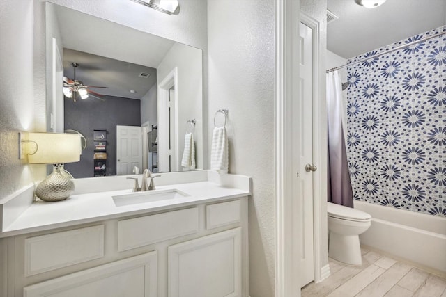 full bathroom with toilet, ceiling fan, vanity, and shower / bathtub combination with curtain