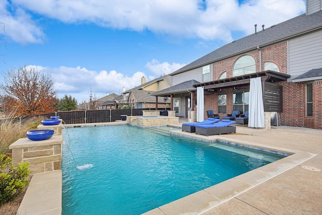 view of swimming pool featuring an outdoor living space, pool water feature, and a patio area