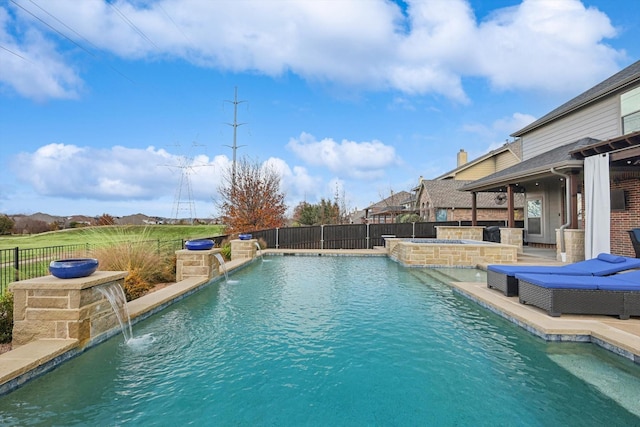 view of swimming pool with pool water feature