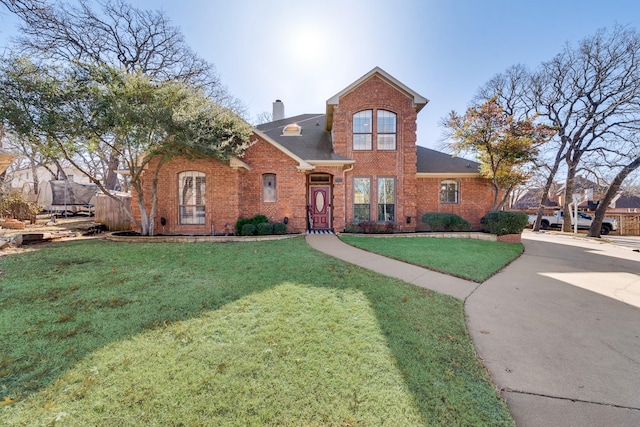 front of property with a trampoline and a front yard