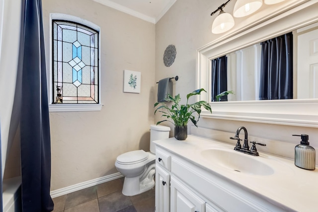 bathroom with vanity, tile patterned flooring, ornamental molding, and toilet