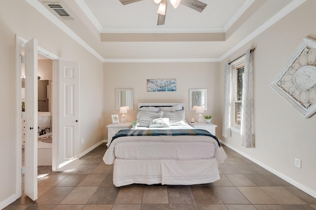 bedroom featuring a raised ceiling, ornamental molding, dark tile patterned flooring, and ceiling fan