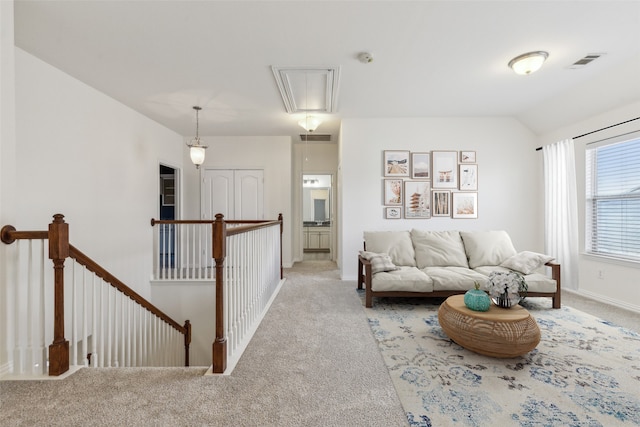 living room featuring lofted ceiling and light carpet