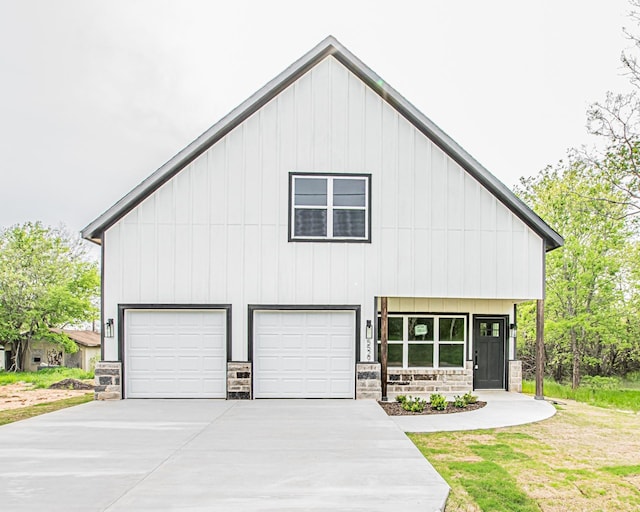 modern inspired farmhouse featuring a garage