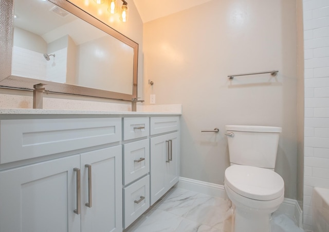 bathroom featuring lofted ceiling, vanity, toilet, and a shower