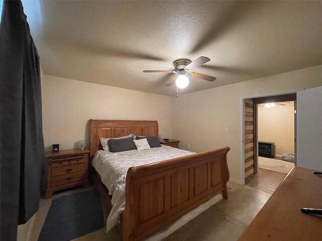 bedroom with ensuite bath and ceiling fan